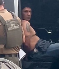Francisco Oropesa sits in a law enforcement vehicle after being taken into custody on May 2 in this screengrab from video taken by a witness.
Mandatory Credit:	Courtesy Evelyn Echeverria