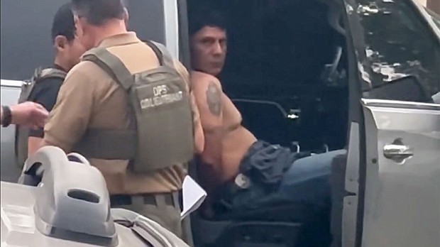 Francisco Oropesa sits in a law enforcement vehicle after being taken into custody on May 2 in this screengrab from video taken by a witness.
Mandatory Credit:	Courtesy Evelyn Echeverria