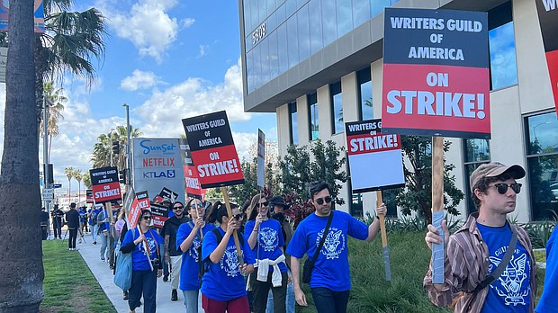TV and film writers are fighting to save their jobs from AI. They won't be the last. Picketing has begun in front of Netflix in Hollywood, California on May 2.
Mandatory Credit:	Stephanie Elam/CNN