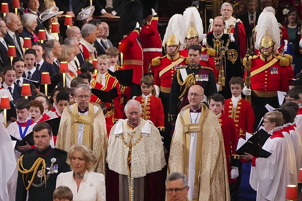 pg. 4 King Charles III followed by his Page of Honour Prince George during his coronation ceremony in Westminster Abbey, London. UK, on May 6, 2023.