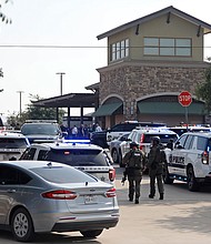 Emergency personnel work the scene of a shooting at Allen Premium Outlets_Stewart  F. House/Getty Images