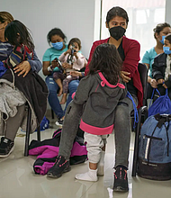 Migrants who had been sent across the border to Ciudad Juárez, across from El Paso, waited at the Juarez Migrant Assistance Center in 2021. Credit/ Paul Ratje for The Texas Tribune