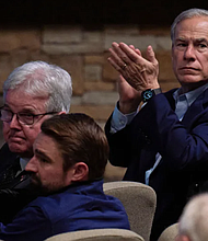 Texas Gov. Greg Abbott, top right, attends a vigil at Cottonwood Creek Church in Allen, Texas, for the victims of a shooting the day before at Allen Premium Outlets on  Sunday May 7. Cooper Neill The New York Times redux