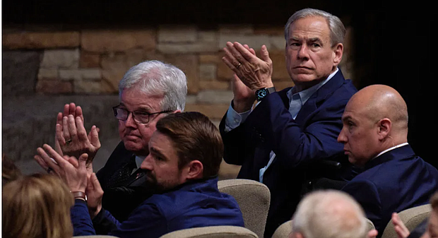 Texas Gov. Greg Abbott, top right, attends a vigil at Cottonwood Creek Church in Allen, Texas, for the victims of a shooting the day before at Allen Premium Outlets on  Sunday May 7. Cooper Neill The New York Times redux