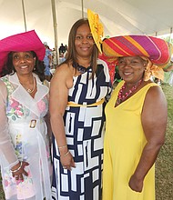 Several hundred people turned out last Saturday for the benefit Derby Day Party in Richmond to enjoy music, games, food and the 149th running of the Kentucky Derby and raise money for the Professionals Reaching Out to the Community (PROC). Leaders of the event included from left, Charmayne B. Vincent, chair of PROC; and the two co-chairs of the event, Janet Hawkes-Pleasants and Natalie Smith. Location: Bon Secours Training Center on Leigh Street. PROC is best known for sponsoring The Beautillion, an etiquette and leadership program for male high school students.