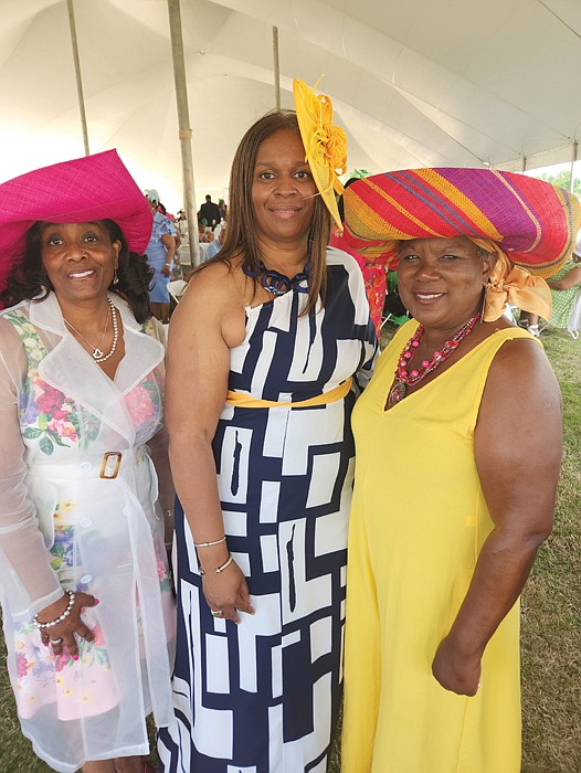 Several hundred people turned out last Saturday for the benefit Derby Day Party in Richmond to enjoy music, games, food and the 149th running of the Kentucky Derby and raise money for the Professionals Reaching Out to the Community (PROC). Leaders of the event included from left, Charmayne B. Vincent, chair of PROC; and the two co-chairs of the event, Janet Hawkes-Pleasants and Natalie Smith. Location: Bon Secours Training Center on Leigh Street. PROC is best known for sponsoring The Beautillion, an etiquette and leadership program for male high school students.