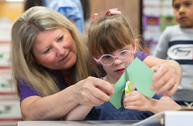 Harris County Department of Education Occupational Therapist Tammy Hillegeist works with Roslyn Black, a student in Cy-Fair ISD, April 11, 2023.