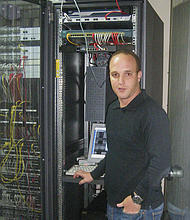 Hicham Al-Hazbari photographed while working as a computer technician in Morocco.