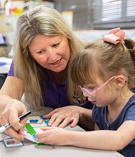 Harris County Department of Education Occupational Therapist Tammy Hillegeist works with Roslyn Black, a pre-kinder student in Cy-Fair ISD, April 11, 2023.