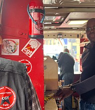 Patrice Clouzeau, left, and Jean-Michel Arcarde, refuse workers affiliated to France's CGT labor union, work in a sausage vending truck.
Mandatory Credit:	Oliver Briscoe/CNN