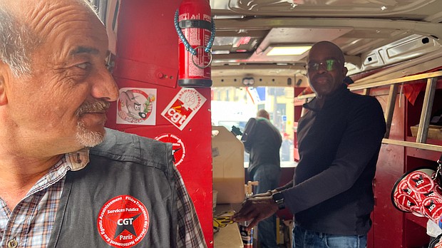 Patrice Clouzeau, left, and Jean-Michel Arcarde, refuse workers affiliated to France's CGT labor union, work in a sausage vending truck.
Mandatory Credit:	Oliver Briscoe/CNN