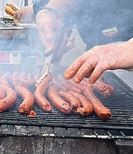 French demonstrators demand spicy hotdog sausages.
Mandatory Credit:	Oliver Briscoe/CNN