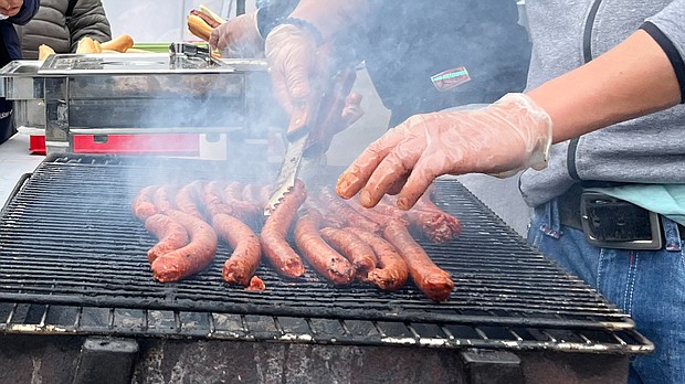 French demonstrators demand spicy hotdog sausages.
Mandatory Credit:	Oliver Briscoe/CNN