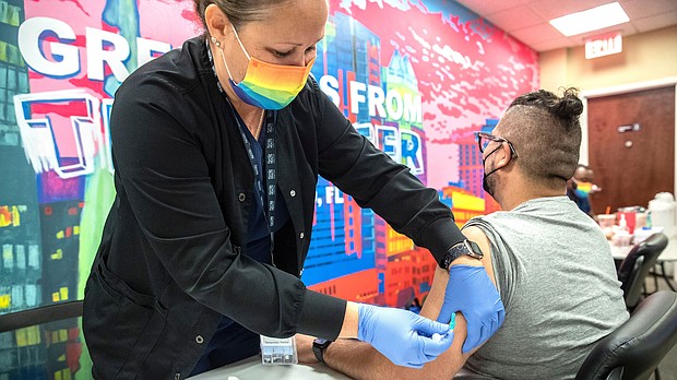 Nurse Kerri Phithibeault gives Danny Garcia an mpox vaccination in Orlando, Florida, in August 2022. The CDC is raising the alarm about the potential risk for new cases of mpox, previously known as monkeypox, to emerge this summer.
Mandatory Credit:	Willie J. Allen Jr./Orlando Sentinel/Getty Images