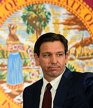 Florida Gov. Ron DeSantis, here on May 9, signed on Monday legislation to defund diversity, equity and inclusion programs at all state universities.
Mandatory Credit:	Rebecca Blackwell/AP/FILE