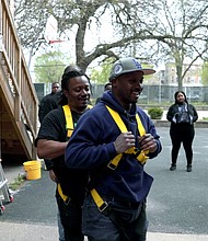 Participants complete harness training to install solar panels at heights. PRNewsfoto/Summit Ridge Energy.