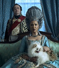 Hugh Sachs as Brimsley and Golda Rosheuvel as Queen Charlotte in "Queen Charlotte: A Bridgerton Story."
Mandatory Credit:	Liam Daniel/Netflix