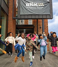 First and second-graders from public schools in Richmond and Henrico County jubilantly jump while participating in the Black History Museum and Cultural Center of Virginia’s Book and Music Festival on May 9.