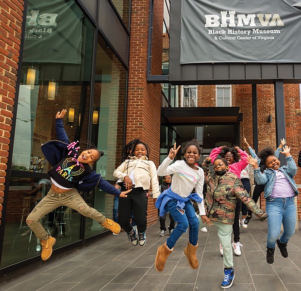 First and second-graders from public schools in Richmond and Henrico County jubilantly jump while participating in the Black History Museum and Cultural Center of Virginia’s Book and Music Festival on May 9.