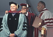 Virginia Union University’s president, Dr. Hakim J. Lucas places an honorary doctoral hood over the head of Dr. John W. Kinney in conferring his honorary doctor of divinity degree for the impact he has had on theological education at VUU for more than 35 years. Assisting with the hooding ceremony Saturday is Dr. W. Franklyn Richardson VUU board president.