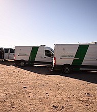 An 8-year-old girl died while in US Customs and Border Protection custody in Harlingen, Texas. In this image, migrants board Border Patrol vans along the border wall in El Paso, Texas, on May 11.
Mandatory Credit:	Patrick T. Fallon/AFP/Getty Images/FILE