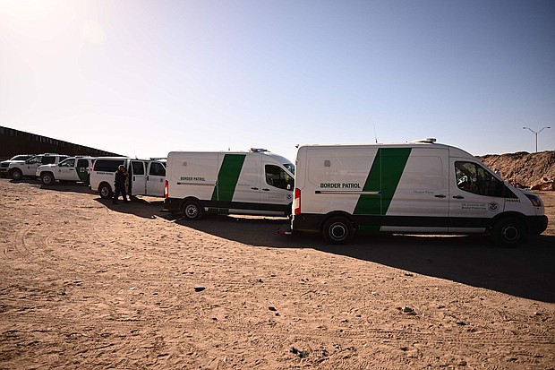 An 8-year-old girl died while in US Customs and Border Protection custody in Harlingen, Texas. In this image, migrants board Border Patrol vans along the border wall in El Paso, Texas, on May 11.
Mandatory Credit:	Patrick T. Fallon/AFP/Getty Images/FILE