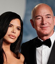 Lauren Sánchez and Jeff Bezos are seen here at the 2023 Vanity Fair Oscar party in Beverly Hills in March. Bezos and Sánchez are engaged, a source close to the couple tells CNN.
Mandatory Credit:	Danny Moloshok/Reuters