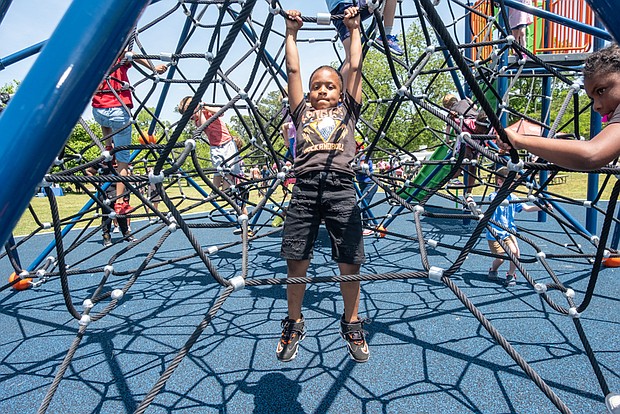 Richmond area youngsters enjoyed the new equipment during a May 20 dedication ceremony for the Markiya Dickson Imagination Zone playground in Fonticello Park. The play area commemorates the life of Markiya who was 9 years-old when she was killed by gunfire that erupted in the park four years ago. Her parents, Ciara Dickson and Mark Whitfield Sr., are pleased with the playground, yet admit that their daughter’s death remains painful. “We’ll never get past it or get over it, so we’re living through it,” said her mother. “We’re learning how to cope with it.”
