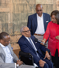 The Rev. William “Bill” Lawson answers questions from his daughter, Channel 13 anchor Melanie Lawson, while Wheeler Avenue Baptist Church Senior Pastor Dr. Marcus D. Cosby, left, and Harris County Commissioner Rodney Ellis listen during the Rev. William “Bill” and Audrey Lawson Park dedication ceremony.