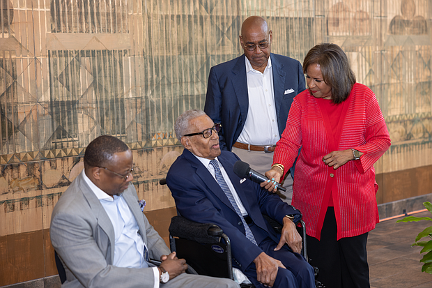 The Rev. William “Bill” Lawson answers questions from his daughter, Channel 13 anchor Melanie Lawson, while Wheeler Avenue Baptist Church Senior Pastor Dr. Marcus D. Cosby, left, and Harris County Commissioner Rodney Ellis listen during the Rev. William “Bill” and Audrey Lawson Park dedication ceremony.
