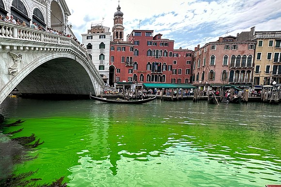 Venetian authorities are investigating after a patch of fluorescent green water appeared in the famed Grand Canal on Sunday morning.