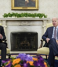House Speaker Kevin McCarthy (left) of California speaks as he meets with President Joe Biden to discuss the debt limit in the Oval Office of the White House on May 22 in Washington.
Mandatory Credit:	Alex Brandon/AP