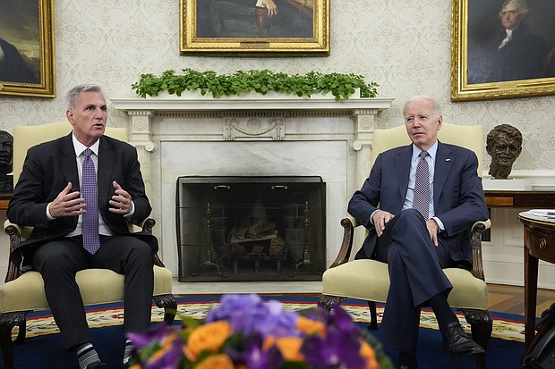 House Speaker Kevin McCarthy (left) of California speaks as he meets with President Joe Biden to discuss the debt limit in the Oval Office of the White House on May 22 in Washington.
Mandatory Credit:	Alex Brandon/AP
