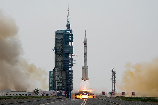A Long March 2F rocket carrying a crew of Chinese astronauts on the Shenzhou-16 spaceship lifts off at the Jiuquan Satellite Launch Center in northwestern China on May 30.
Mandatory Credit:	Mark Schiefelbein/AP