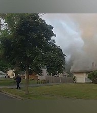 An 85-year-old man and passerby helped alert a sleeping family early Wednesday morning that their house was on fire in South Brunswick Township, New Jersey.
Mandatory Credit:	From SoBrunswickPD/Twitter