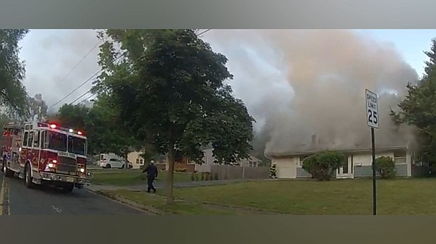An 85-year-old man and passerby helped alert a sleeping family early Wednesday morning that their house was on fire in South Brunswick Township, New Jersey.
Mandatory Credit:	From SoBrunswickPD/Twitter