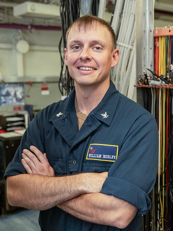 Petty Officer 3rd Class William Mobley, a native of Houston, was recognized as Junior Sailor of the Quarter aboard USS …