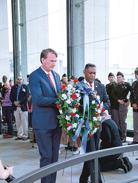 Gov. Glenn Youngkin gave the keynote address during the commonwealth’s 67th Annual Memorial Day ceremony at the Virginia War Memorial on May 29 in Richmond. He then joined Secretary of Veterans and Defense Affairs Craig Crenshaw and Army Maj. Gen. Timothy P. Williams, adjutant general of Virginia, in laying a wreath on the Shrine of Memory.