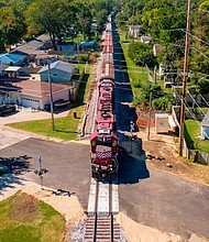 Officials are putting millions of dollars into fixing dangerous intersections where trains and cars meet. Pictured is a freight train at a railroad crossing in Camanche, Iowa, in 2022.
Mandatory Credit:	Tammy Ljungblad/Kansas City Star/Tribune News Service/Getty Images