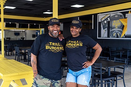 Bun B and wife Queenie Freeman inside Trill Burgers