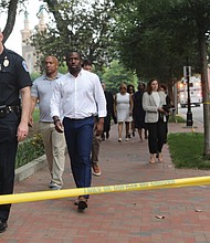 Acting Police Chief Rick Edwards leads the way with other city officials, including Richmond Mayor Levar M. Stoney, City Council President Michael Jones, to brief members of the media following an afternoon shooting after Hugeunot High School commencement inside Altria Theater that left two people dead, including a graduate and a relative outside the building Tuesday.