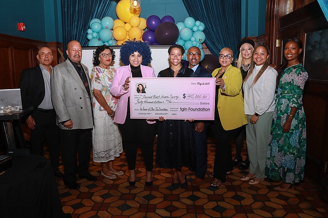 tgin Foundation presents a donation to Harvard Black Alumni Society in honor of its foundation the late Chris-Tia.  Chris -Tia passed away of breast cancer in 2021.  Photo provided by D. Williams Public Relations & Event Management Group