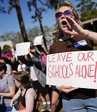 New College of Florida students and supporters protest ahead of a meeting by the college's board of trustees on February 28. Across the country, protests over cuts to DEI initiatives in colleges have mounted.
Mandatory Credit:	Rebecca Blackwell/AP