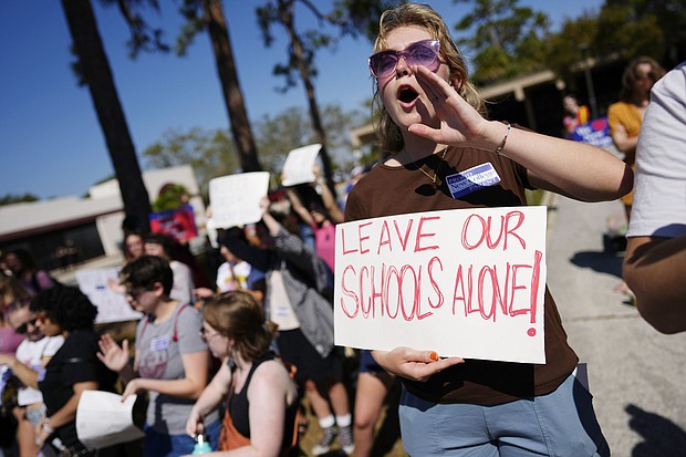 New College of Florida students and supporters protest ahead of a meeting by the college's board of trustees on February 28. Across the country, protests over cuts to DEI initiatives in colleges have mounted.
Mandatory Credit:	Rebecca Blackwell/AP