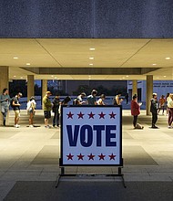 At least 11 states have enacted 13 restrictive voting laws this year. Voters here wait in line at a polling place in Austin, Texas, on election night November 8, 2022.
Mandatory Credit:	Jay Janner/Austin American-Statesman/AP/FILE