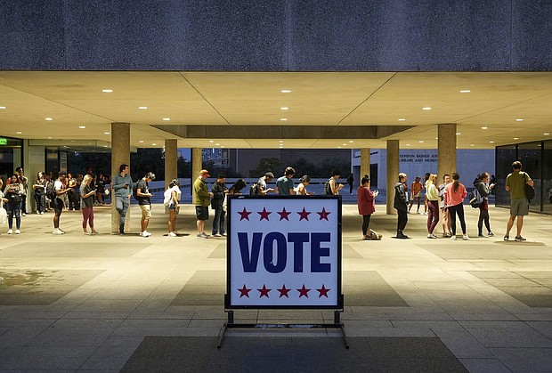 At least 11 states have enacted 13 restrictive voting laws this year. Voters here wait in line at a polling place in Austin, Texas, on election night November 8, 2022.
Mandatory Credit:	Jay Janner/Austin American-Statesman/AP/FILE