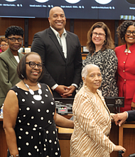 Chief Administrative Officer for the City of Richmond, Lincoln Saunders, left, and Richmond City Council members, Stephanie A. Lynch, 5th District, second from left, Reva M. Trammell, 8th District, Cynthia I. Newbille 7th District, Council President Michael Jones, 9th District, center, Council Vice-President, Kristen M. Nye, 4th District, Ann-Frances Lambert, 3rd District, Katherine Jordan, 2nd District, Ellen F. Robertson, 6th District, and Andreas D. Addison, 1st District, pose for a group photo with Richmond Free Press managing editor, Bonnie Newman Davis, Jean Patterson Boone, publisher and co-founder, and Raymond H. Boone Jr. , vice president for new business development, following a Richmond City Council Recognition Award presented to Jean P. Boone and her husband, Raymond H. Boone Sr., posthumously, the former editor/ publisher/ founder of the Richmond Free Press for their collective work with their staff in the city through their weekly newspaper founded 31 years ago in 1992. Mr. Boone died nine years ago, June 3, 2014, after a brief battle with pancreatic cancer.