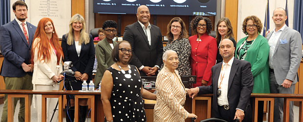 Chief Administrative Officer for the City of Richmond, Lincoln Saunders, left, and Richmond City Council members, Stephanie A. Lynch, 5th District, second from left, Reva M. Trammell, 8th District, Cynthia I. Newbille 7th District, Council President Michael Jones, 9th District, center, Council Vice-President, Kristen M. Nye, 4th District, Ann-Frances Lambert, 3rd District, Katherine Jordan, 2nd District, Ellen F. Robertson, 6th District, and Andreas D. Addison, 1st District, pose for a group photo with Richmond Free Press managing editor, Bonnie Newman Davis, Jean Patterson Boone, publisher and co-founder, and Raymond H. Boone Jr. , vice president for new business development, following a Richmond City Council Recognition Award presented to Jean P. Boone and her husband, Raymond H. Boone Sr., posthumously, the former editor/ publisher/ founder of the Richmond Free Press for their collective work with their staff in the city through their weekly newspaper founded 31 years ago in 1992. Mr. Boone died nine years ago, June 3, 2014, after a brief battle with pancreatic cancer.