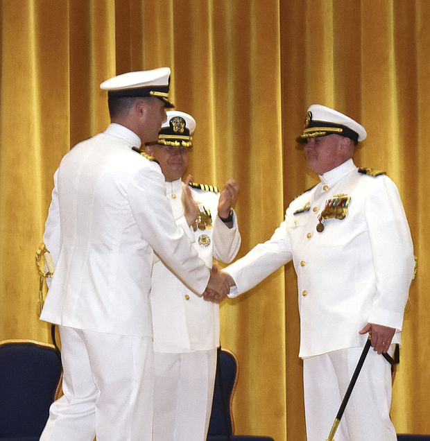 Photo By Selena Brock | 230616-N-IW561-0033 KITTERY, Maine (June 16, 2023) – Cmdr. Robert Lane, right, outgoing commanding officer of the USS Greeneville (SSN 772), shakes hands with his relief Cmdr. Chad Tella during a change-of-command ceremony at Portsmouth Naval Shipyard (PNSY) in Kittery, Maine, June 16. Capt. Daniel Reiss, center, commander of Submarine Squadron (SUBRON) TWO, presided over the ceremony. SUBRON Two provides administrative, logistical, and operational support for fast-attack submarines homeported at PNSY during periods of maintenance and improvement. (U.S. Navy photo by Selena Brock)