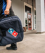 A Domino's Pizza employee returns from a delivery in 2021 in Houston, Texas.
Mandatory Credit:	Brandon Bell/Getty Images